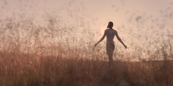 lady walking in a field